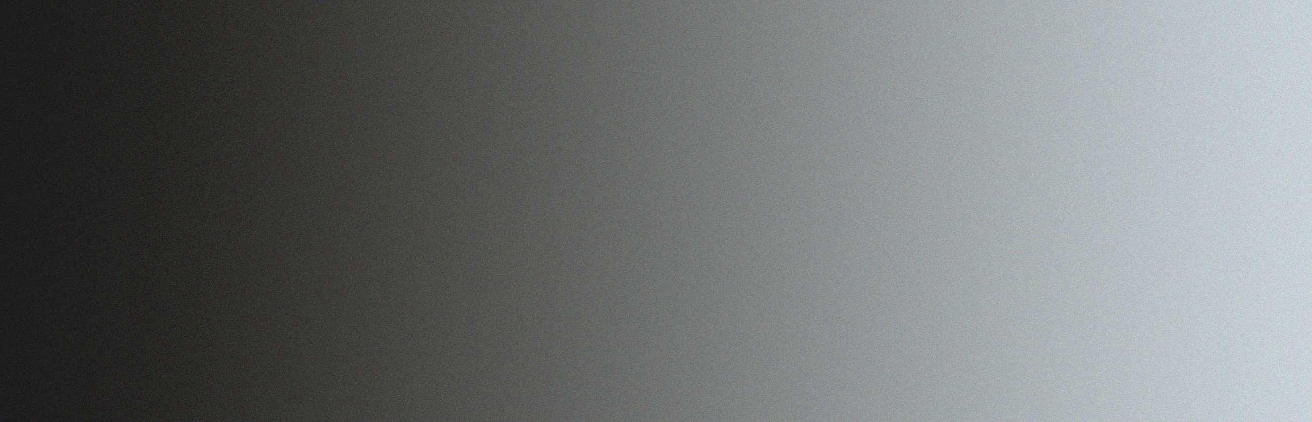 A gradient background transitioning from dark grey on the left to light grey on the right.